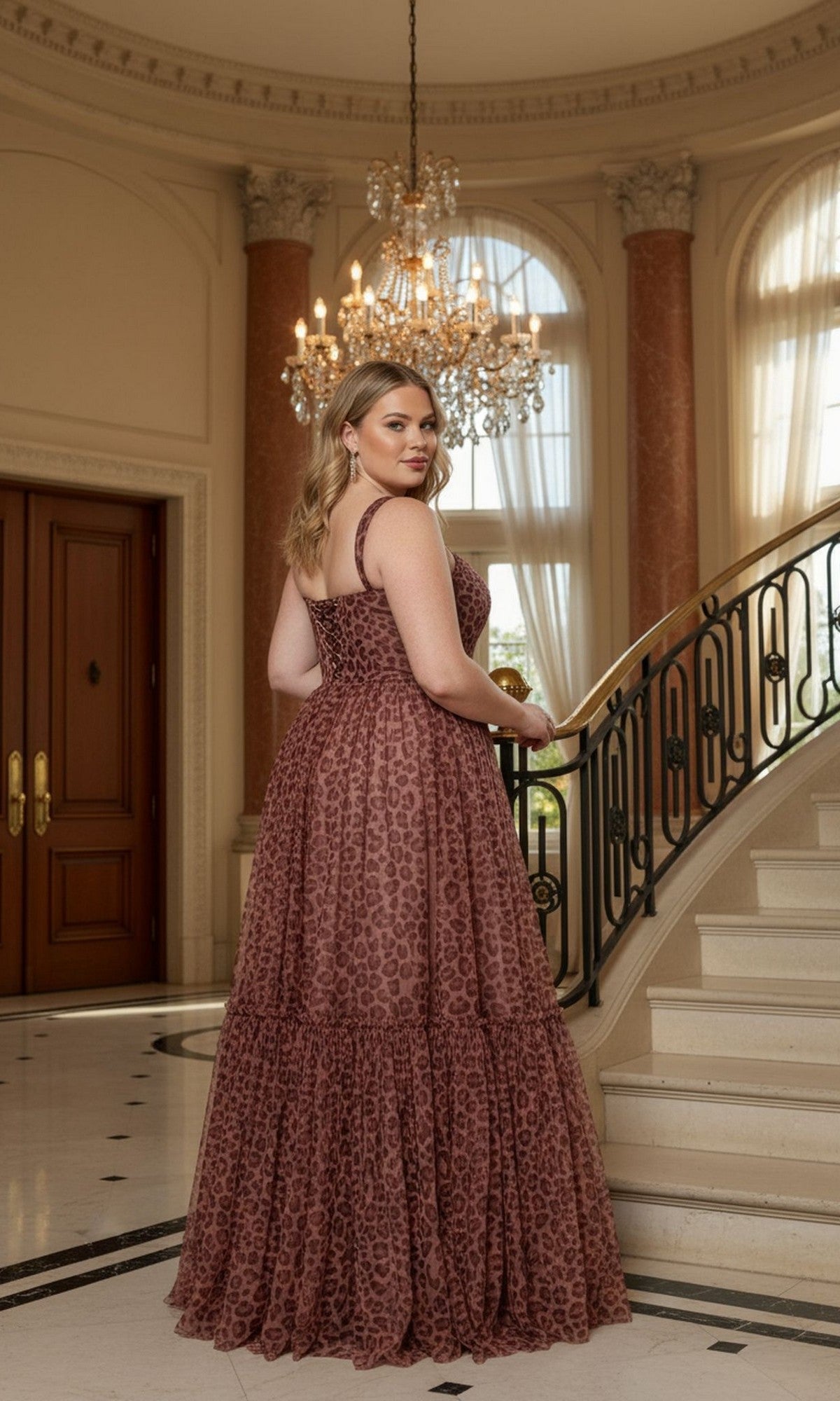 A woman in the Long Plus-Size Prom Dress: Poly USA W1226 poses on a marble staircase in an elegant room with large windows and a chandelier.